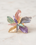 Multicolour enamel orchid flower cocktail ring on marble surface