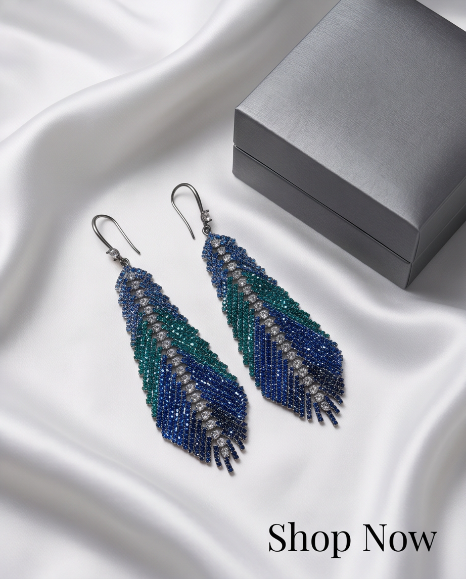 Ocean Ombre Crystal Feather Drop Earrings displayed on black jewellery stand