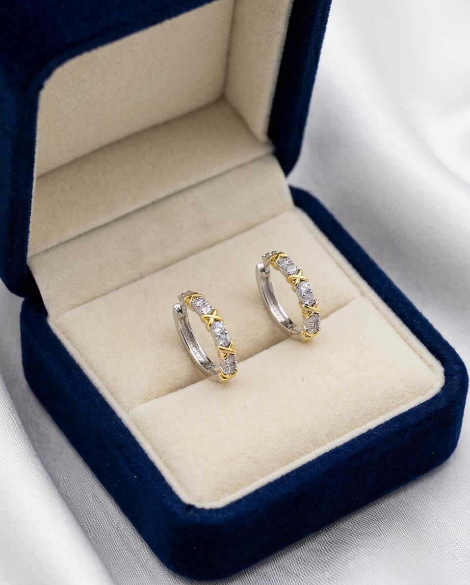 Gold X cross cubic zirconia hoop earrings close-up detail