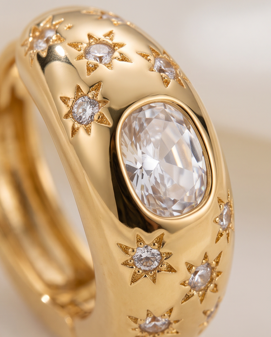 Gold Celestial Star Hoop Earrings — pair on white satin
