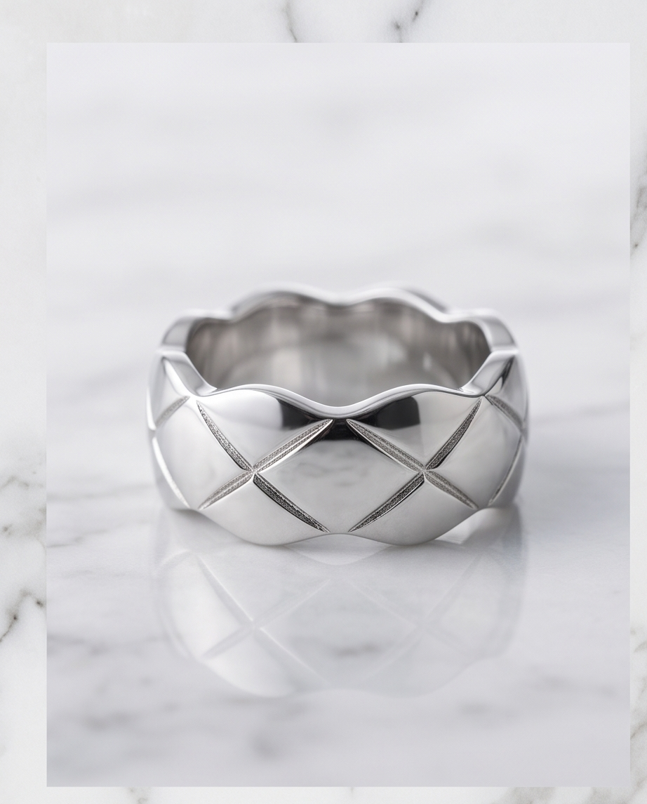 Silver quilted dome ring in grey velvet gift box on marble