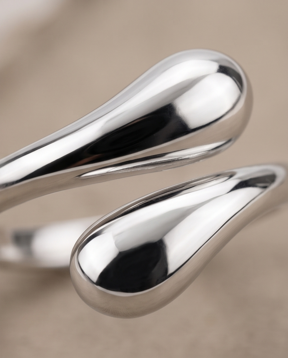 925 silver plated sculptural double teardrop wrap open adjustable ring on natural linen fabric showing full profile and wrap silhouette