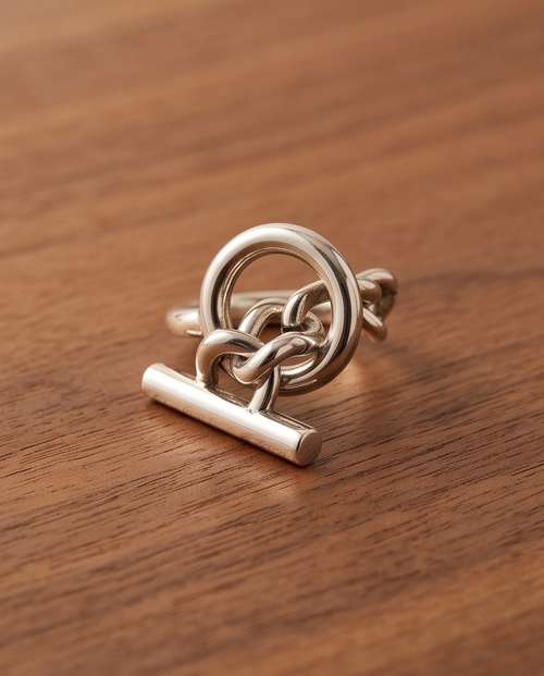 925 silver plated high polish celtic love knot circle toggle bar open adjustable ring on warm walnut wood surface in natural light showing full profile and toggle bar pendant