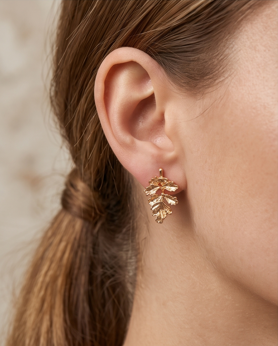 Gold textured oak leaf drop earrings product shot