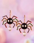 Rainbow Spider Pearl Drop Earrings worn on model with Halloween cardigan
