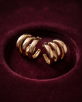 Gold triple band chunky hoop earrings in burgundy velvet jewellery dish