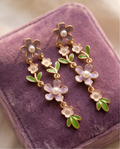 Close-up of the lilac enamel flower with a pearl centre