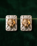 Pair of gold-tone tiger head studs on textured silver-tone rectangular plaques