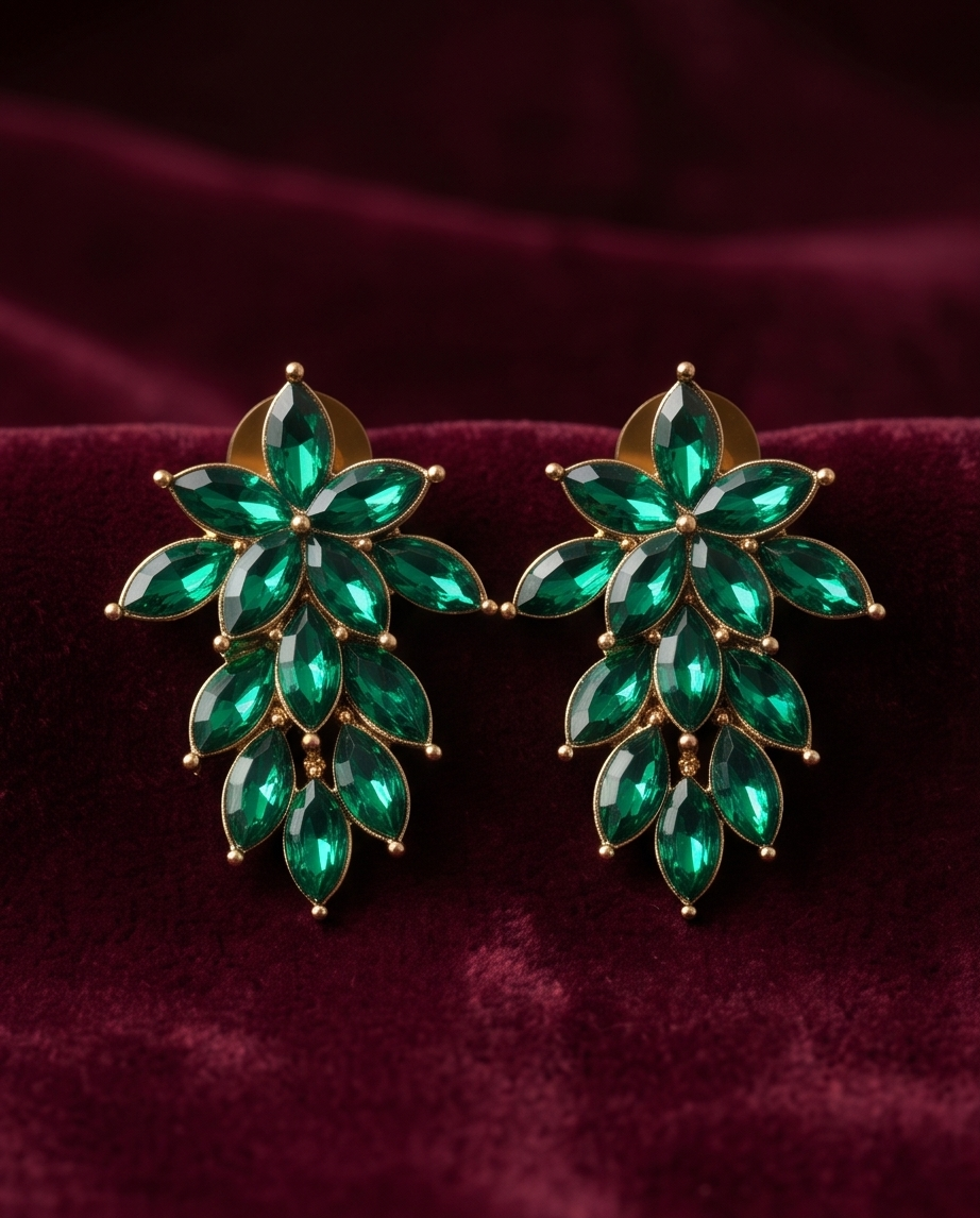 Emerald green floral drop earring worn on ear, showing styling and scale