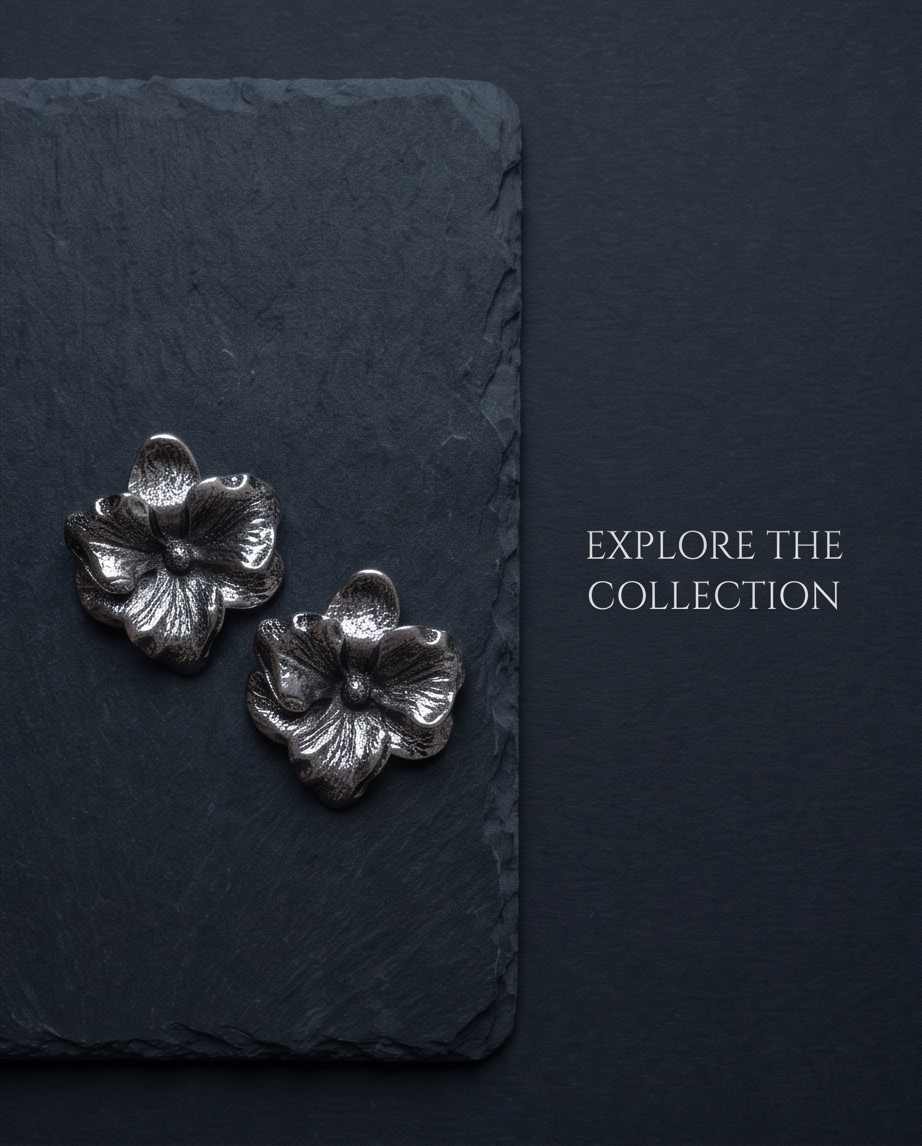 Close-up of sculpted silver-tone flower earring petals
