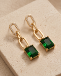Front view of green rectangular stone chain drop earrings