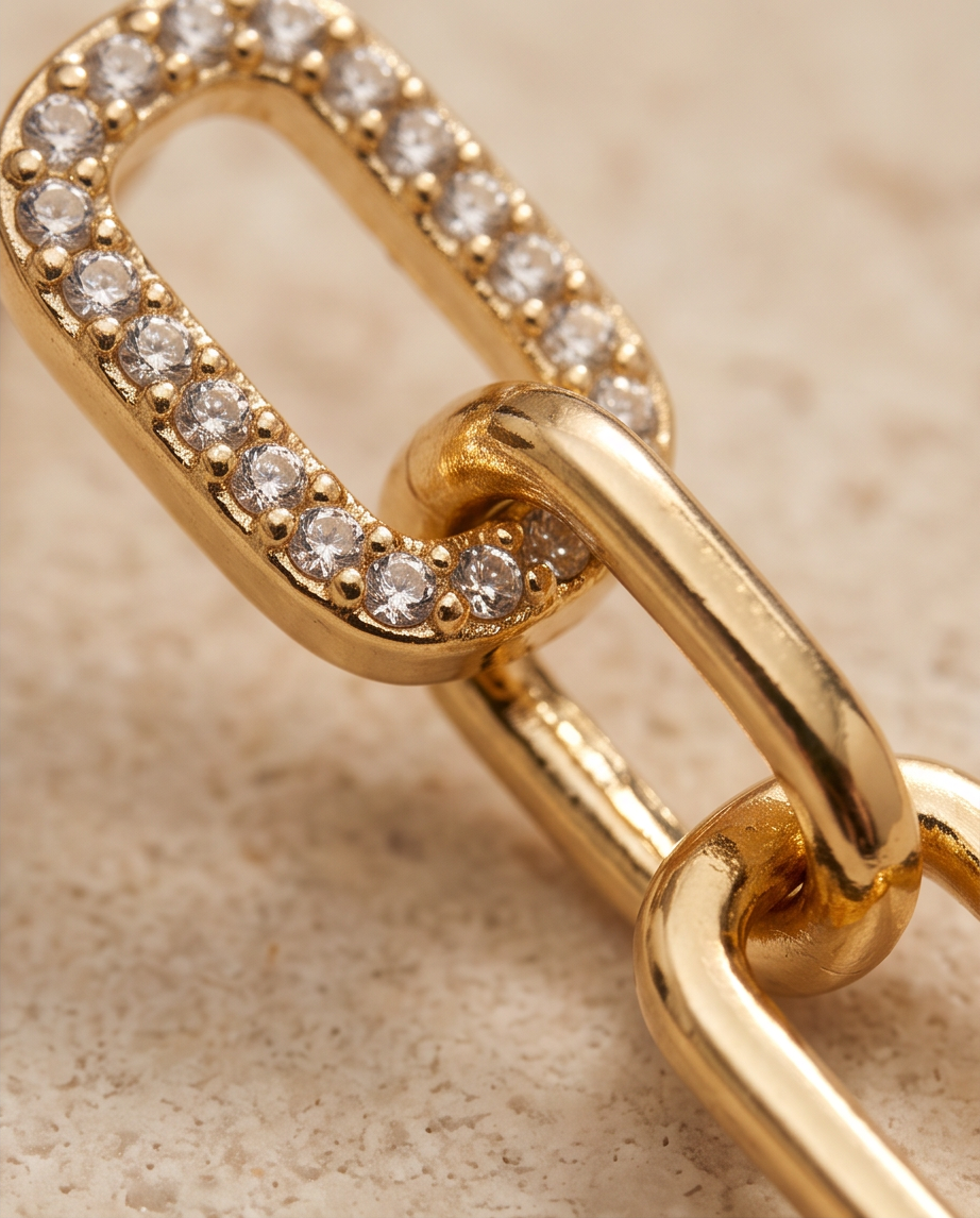 Pair of gold-tone chain drop earrings with rectangular emerald-green stones