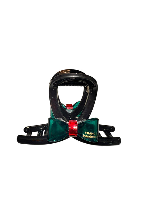 Snowboard binding with green and red accents on a white background