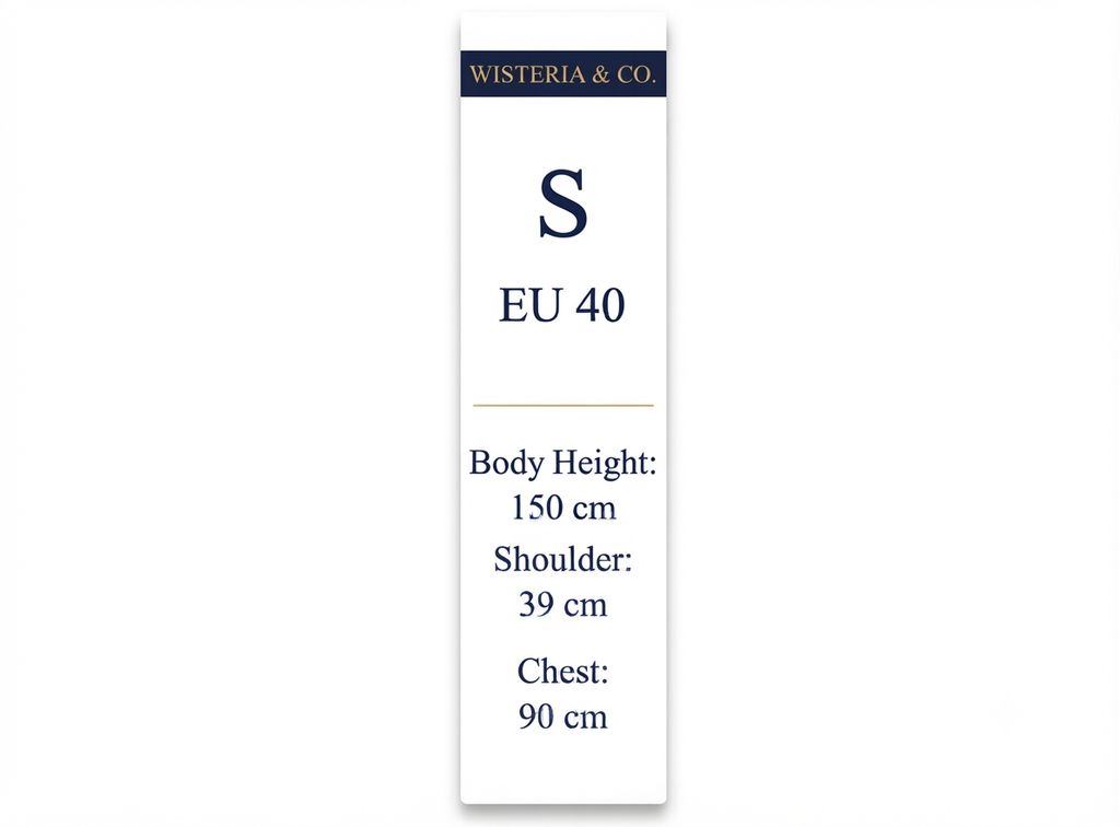 A tall white sizing card with navy text reading 'WISTERIA & CO' at the top, size 'S' and 'EU 40', plus body height 150 cm, shoulder 39 cm, and chest 90 cm, on a light gray background.