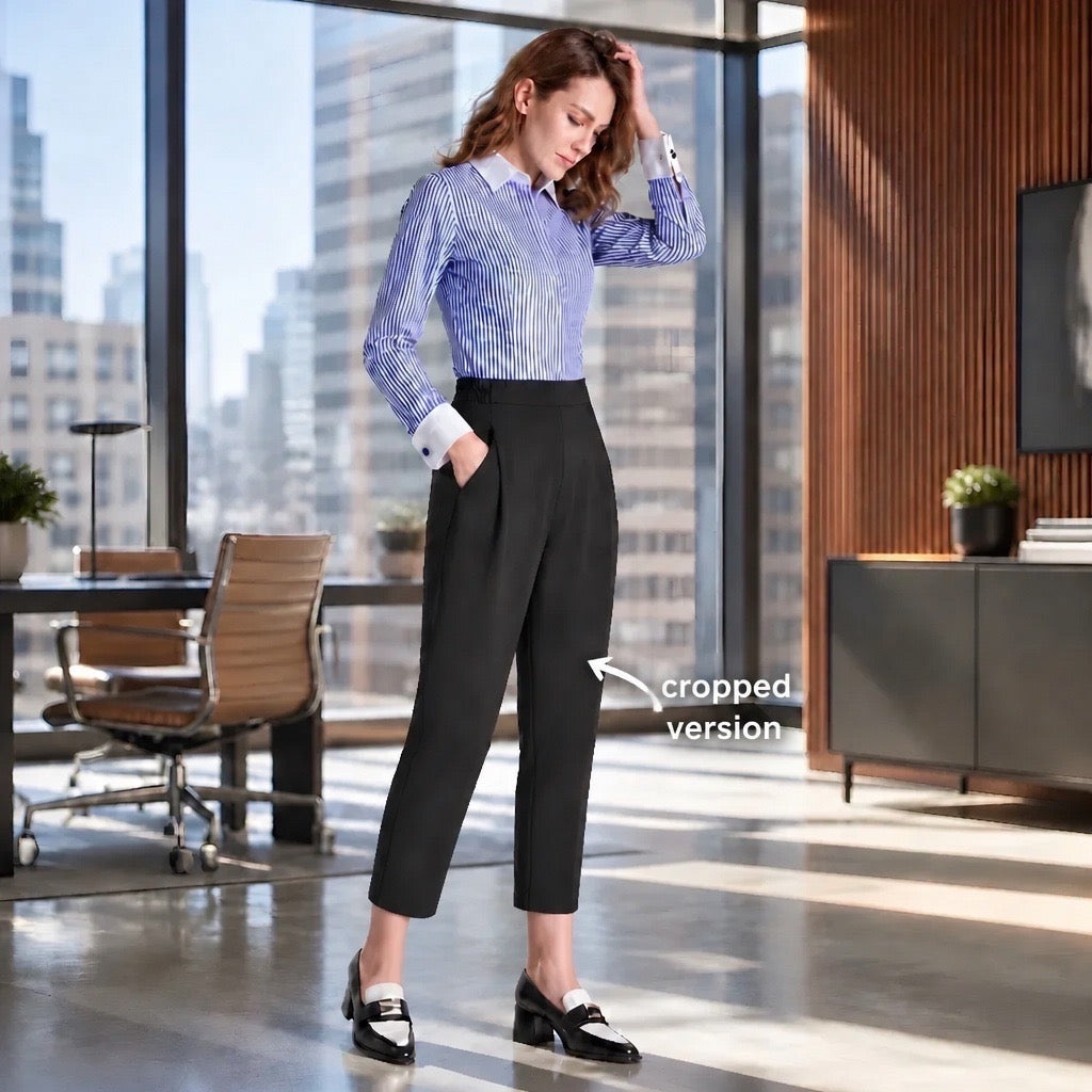 A woman stands in a modern office wearing a blue and white striped button-down shirt and black cropped trousers, with a text overlay pointing to the pants that reads 'cropped version'.