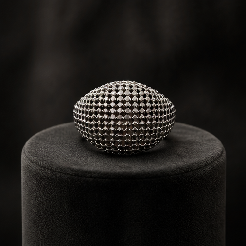 Gunmetal dome pavé ring in black jewellery box on marble surface