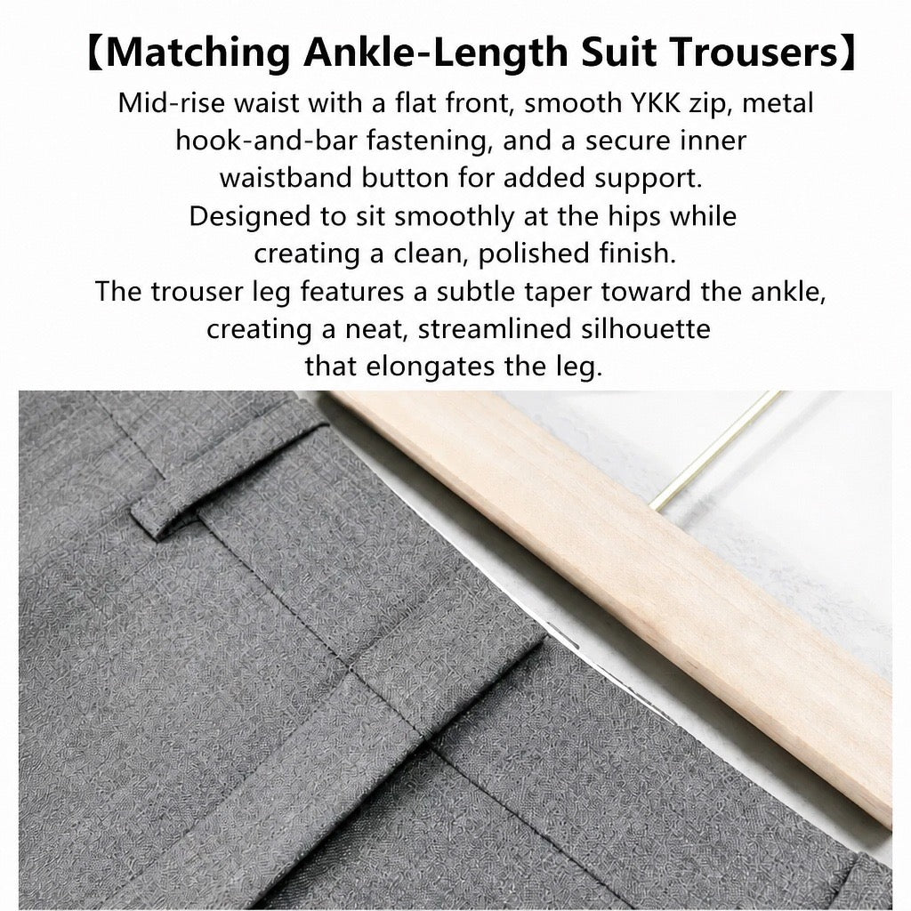 Text-heavy product detail image showing close-up of gray tailored trousers with a wooden hem and a light floor/background, plus descriptive English text about ankle-length suit trousers.