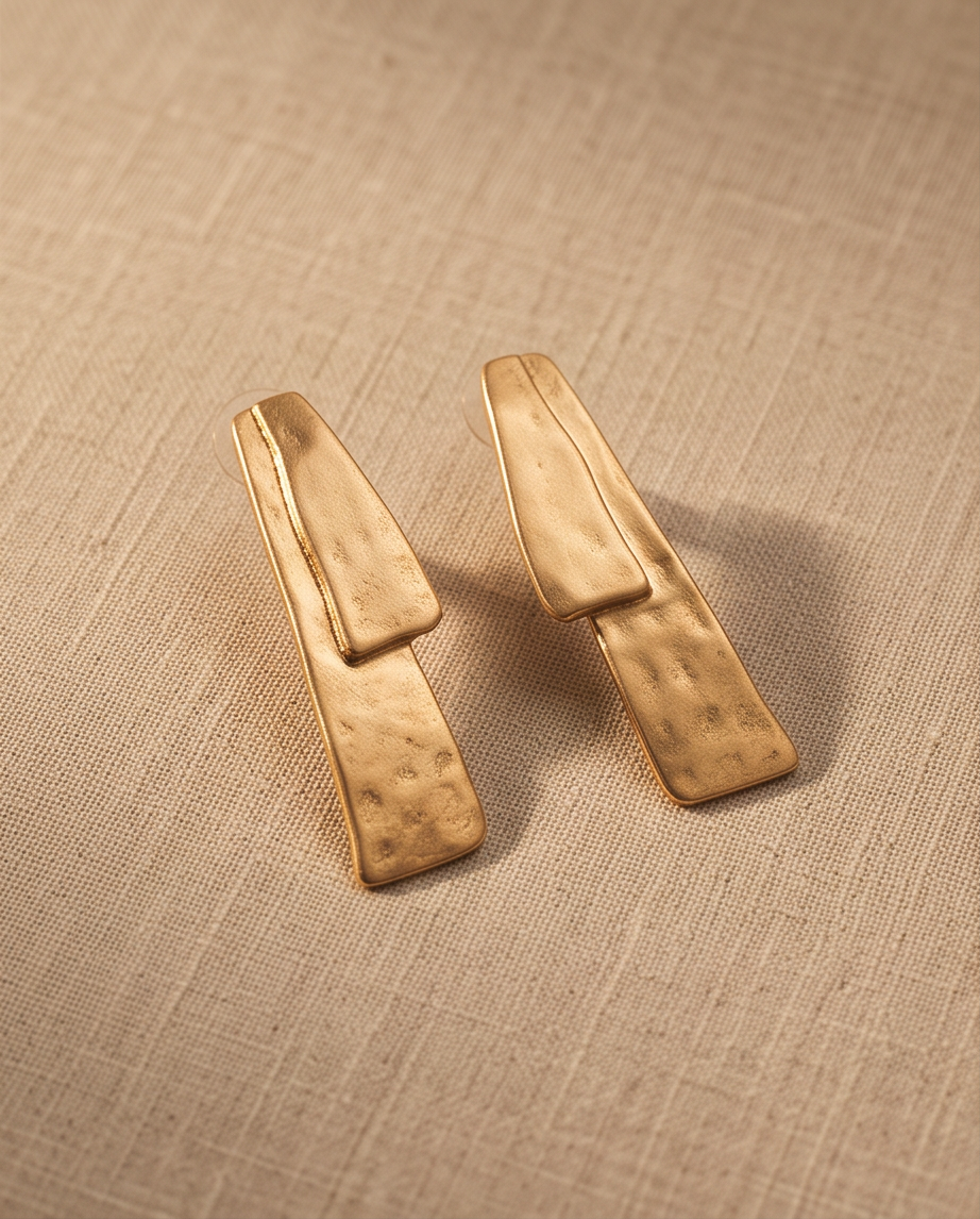 Gold Hammered Double Bar Drop Earrings - product flat lay on linen