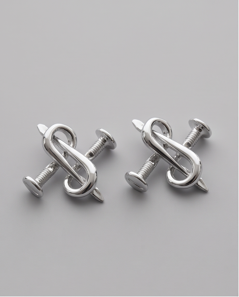 Silver S-Curl Nail Stud Earrings - pair flat lay on grey background