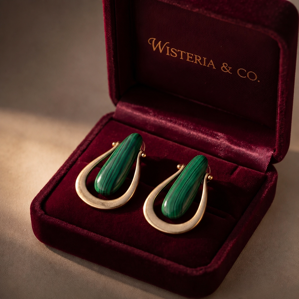 Gold tone open teardrop and malachite stone drop earrings in Wisteria & Co. jewellery box