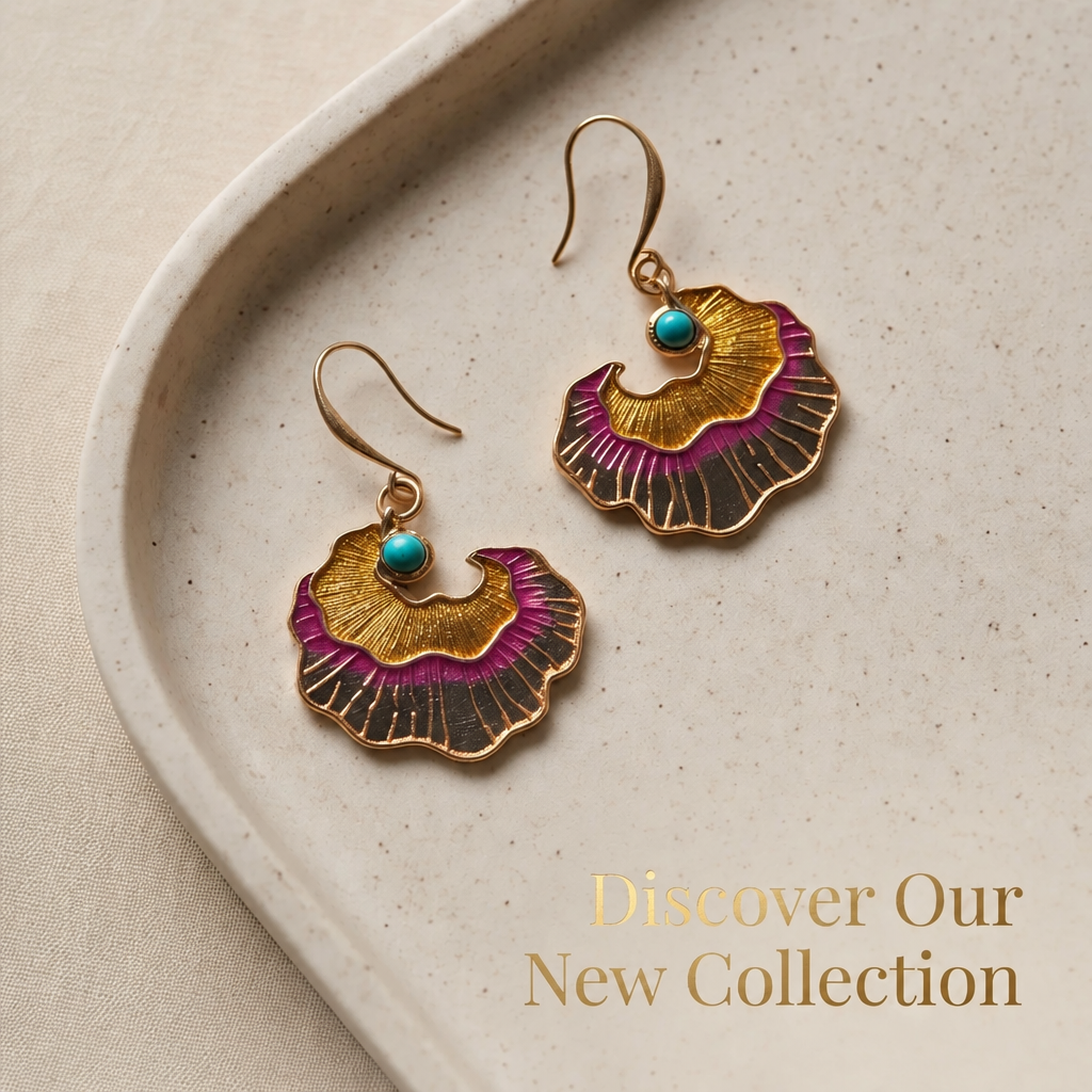 Gold Enamel Ginkgo Fan Drop Earrings — campaign flat lay on ceramic dish