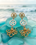 Steampunk Octopus Gear Drop Earrings — model wearing at sunset