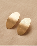 Gold Textured Oval Disc Stud Earrings — close-up macro detail of etched texture