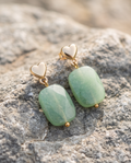 Gold Heart Stud & Green Stone Drop Earrings on granite rock