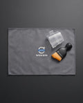 Volvo Car Dashboard Cleaning Set placed on leather car seat