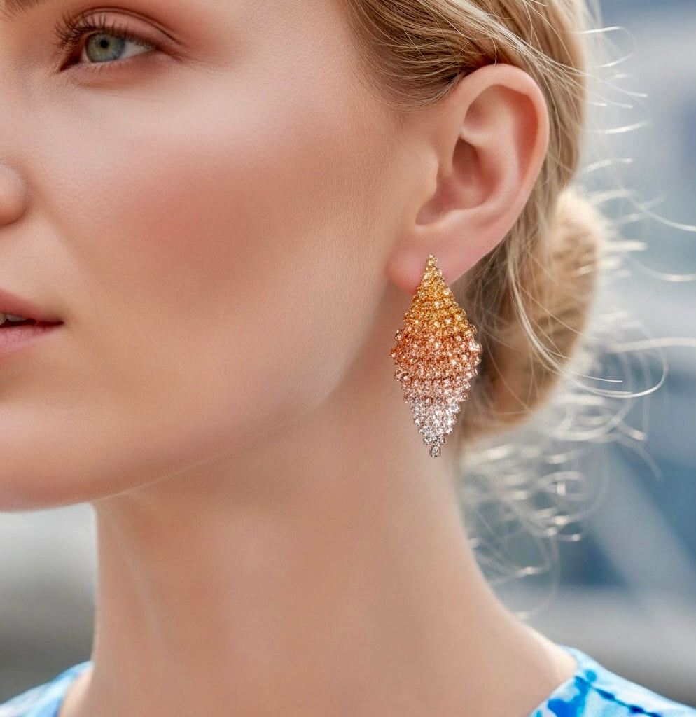Close-up of a woman wearing a sparkling earring with a blurred background
