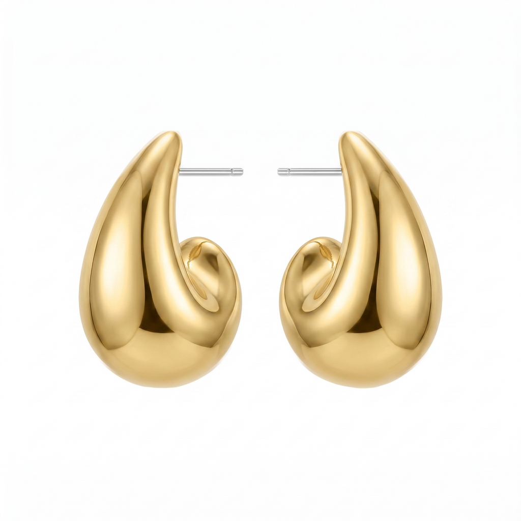 Gold earrings on a white background