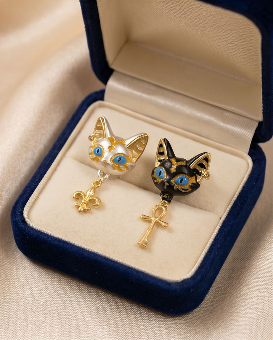 Egyptian Cat Goddess Mismatched Drop Earrings - ceramic dish flat lay both earrings
