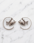 Silver angelfish spiral hoop earrings in kraft gift box with white seashell on white background