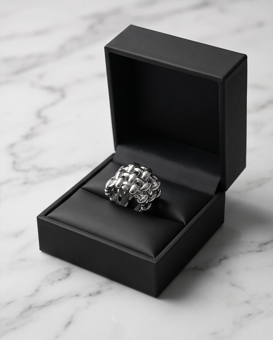 Silver Woven Basket Weave Wide Band Ring worn on model's hand holding crystal glass