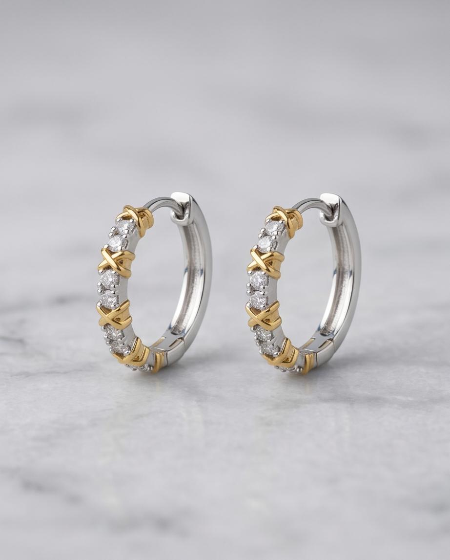 Gold X cross cubic zirconia hoop earrings in navy jewellery box