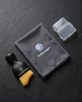 Volkswagen Car Dashboard Cleaning Set — flat lay with microfibre cloth, detailing brush and protective cap