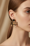 Gold & Black Chain Bow Drop Earrings — Jawline Close-Up
