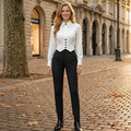 Aspirational lifestyle image of model in monochrome power co-ord set on European cobblestone street